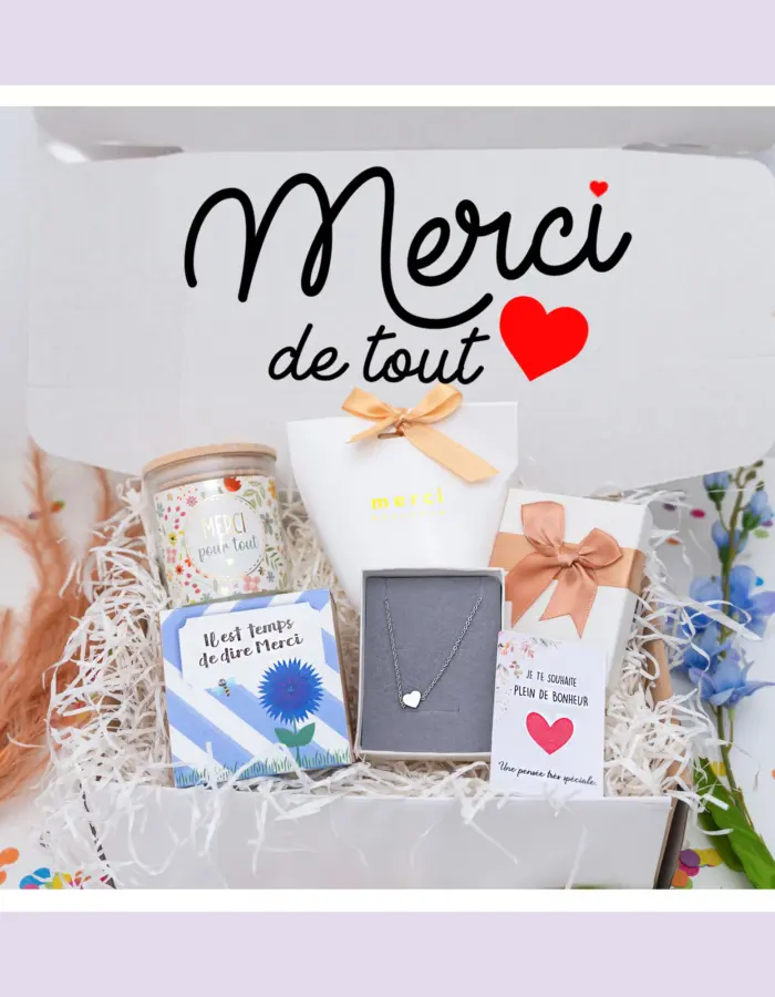 Cadeau 'Merci' dans une box cadeau : bougie, bonbons, bijou, tasse personnalisée et eco cube, une manière originale et écologique de dire merci.